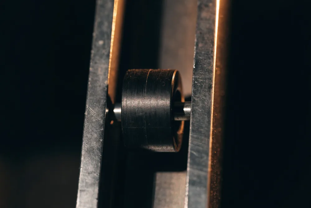 A garage door roller seated in its vertical track